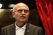 نصب بنری توهین‌ آمیز بر سنگ مزار بهمن کشاورز