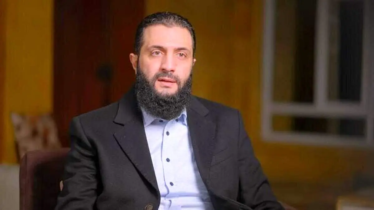 تیپ رهبر مخالفان اسد در تلویزیون خبرساز شد + عکس 