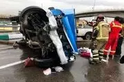 واژگونی هولناک نیسان آبی در اتوبان باکری تهران/ عکس